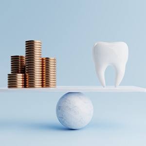Illustration of coins balanced against a tooth