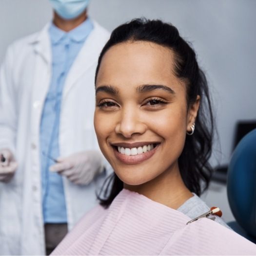 Woman smiling while at her dental checkup and cleaning in Dallas