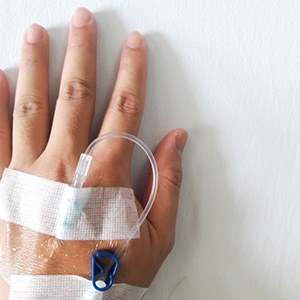 Close-up of IV in person’s hand