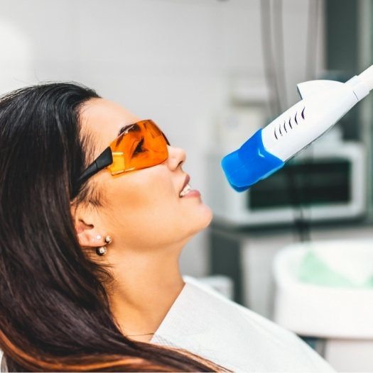 Dental patient getting her teeth professionally whitened